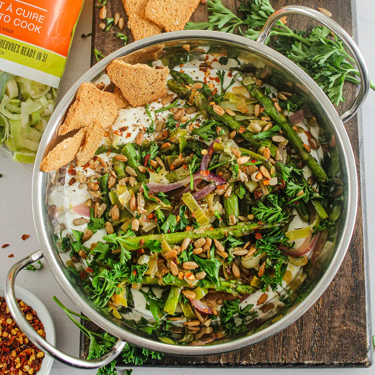 Whipped feta cheese, asparagus and leek sauté with roasted sunflower seeds